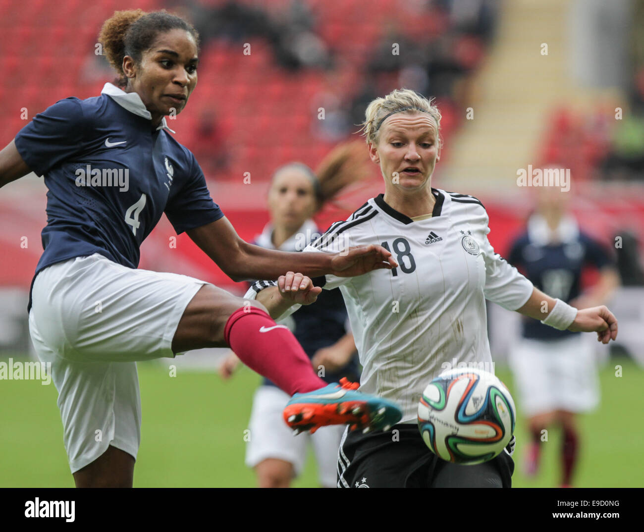 Offenbach, Germany. 25th Oct, 2014. France's Laura Georges (L) and Alexandra Popp (R) in action during the women's soccer international match between Germany and France in Offenbach, Germany, 25 October 2014. Photo: FRANK RUMPENHORST/dpa/Alamy Live News Stock Photo
