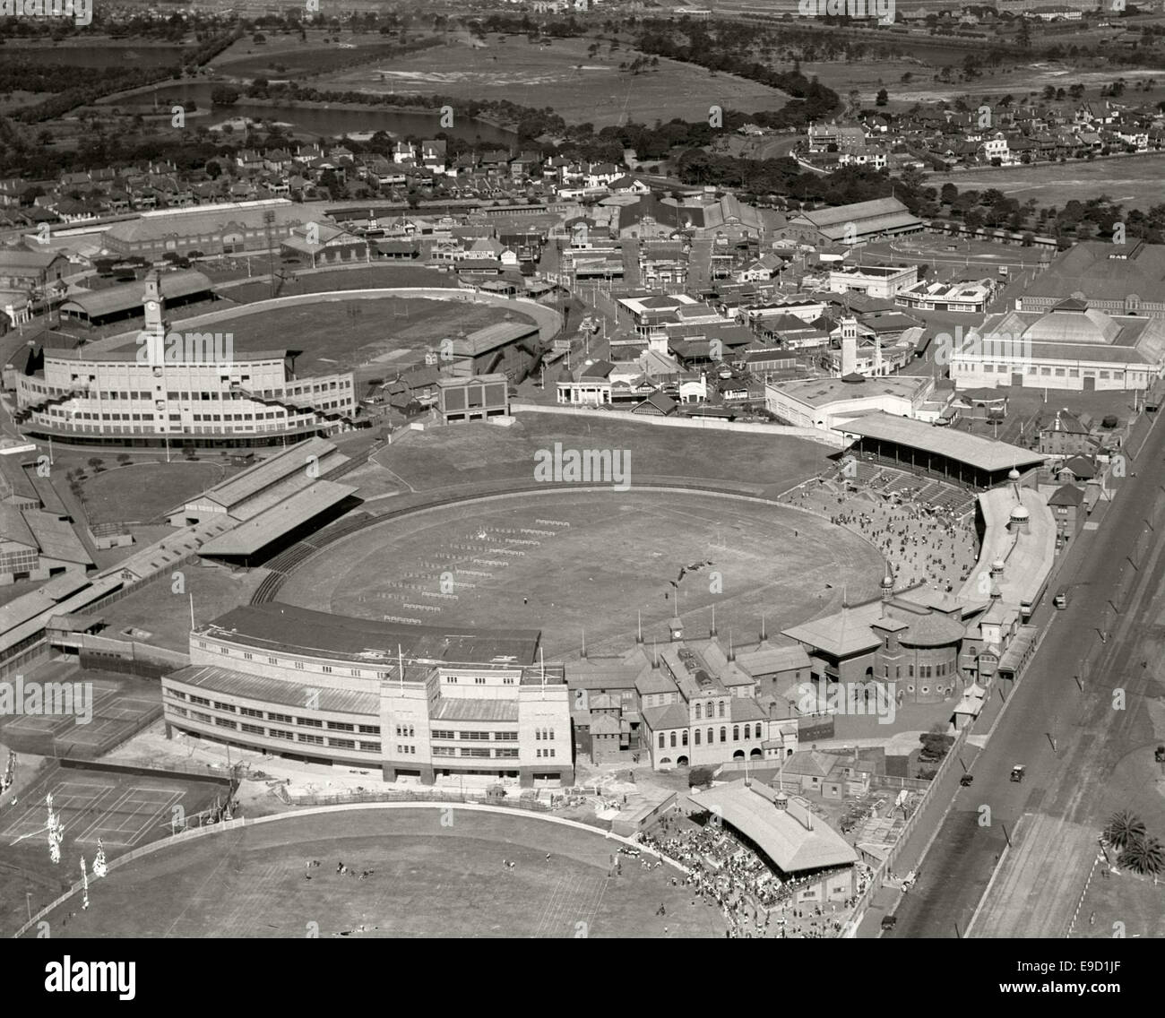 This aerial photograph from the Adastra Aerial Survey Collection captures the Sydney Showground and Cricket Ground in 1936. It highlights the layout of the stadium and surrounding areas during a significant period in Sydney’s sports history. Stock Photo