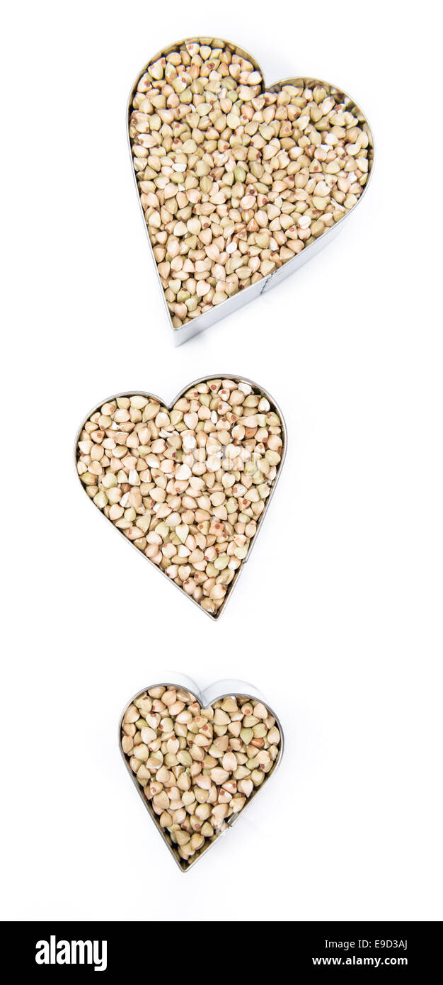 Buckwheat in heart shapes isolated on white background Stock Photo Alamy