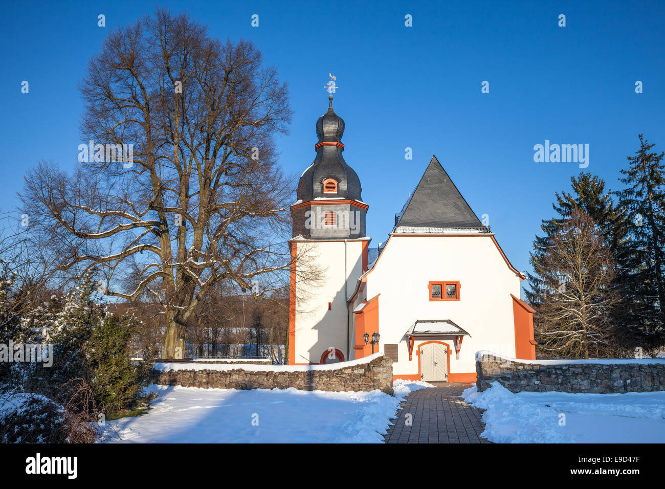 Village church in Niederseelbach in winter, Taunus, Hesse, Germany Stock Photo