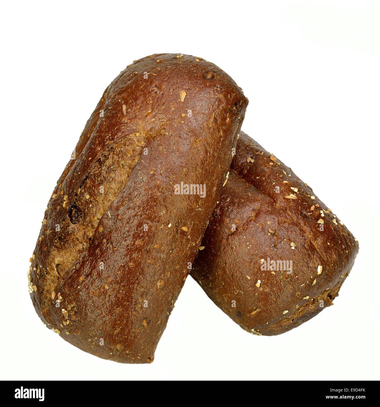 Two large Pumpernickel rolls on a white background. Stock Photo