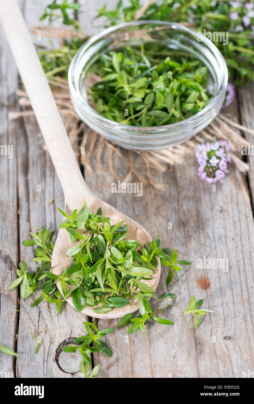 Portion of fresh Winter Savory (close-up shot) on a cooking spoon Stock Photo