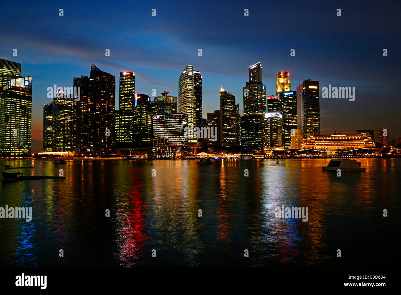 Singapore skyline of the Financial District at dusk from Marina Bay, Singapore Stock Photo