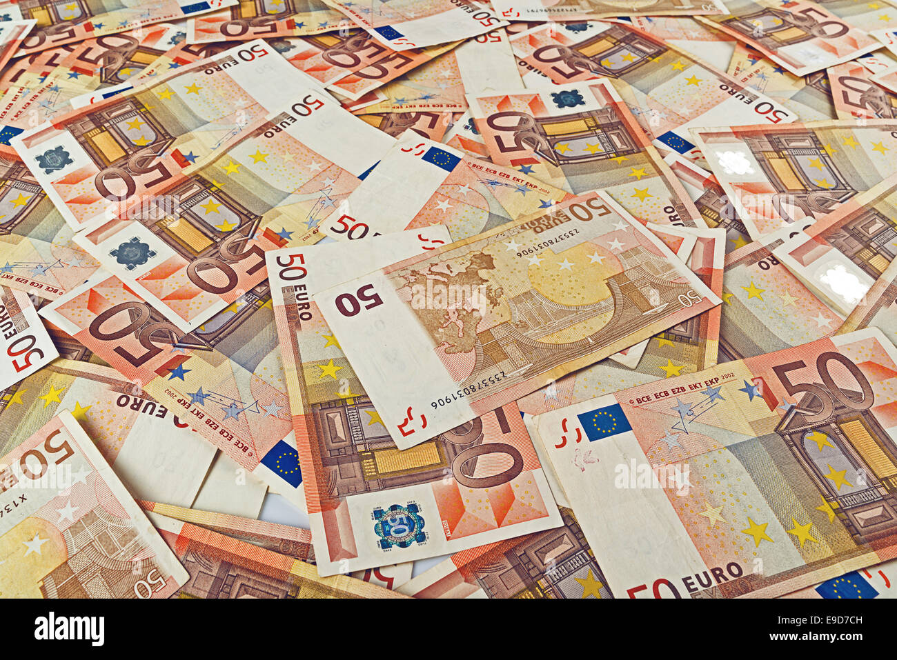 Pile of fifty euro banknotes as seamless background for financial and economy themes. Stock Photo