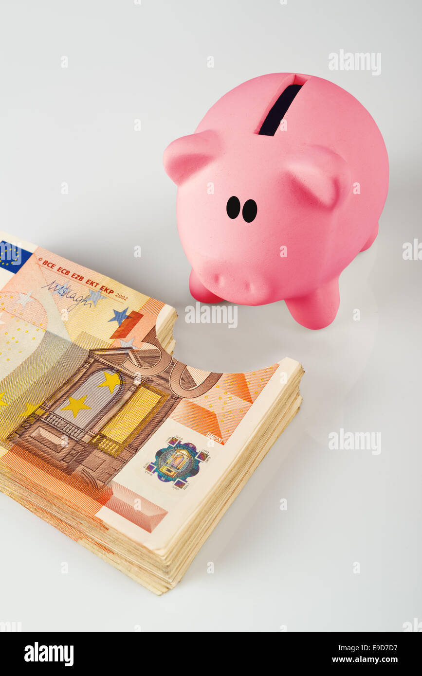 Piggy bank eating coin hires stock photography and images Alamy