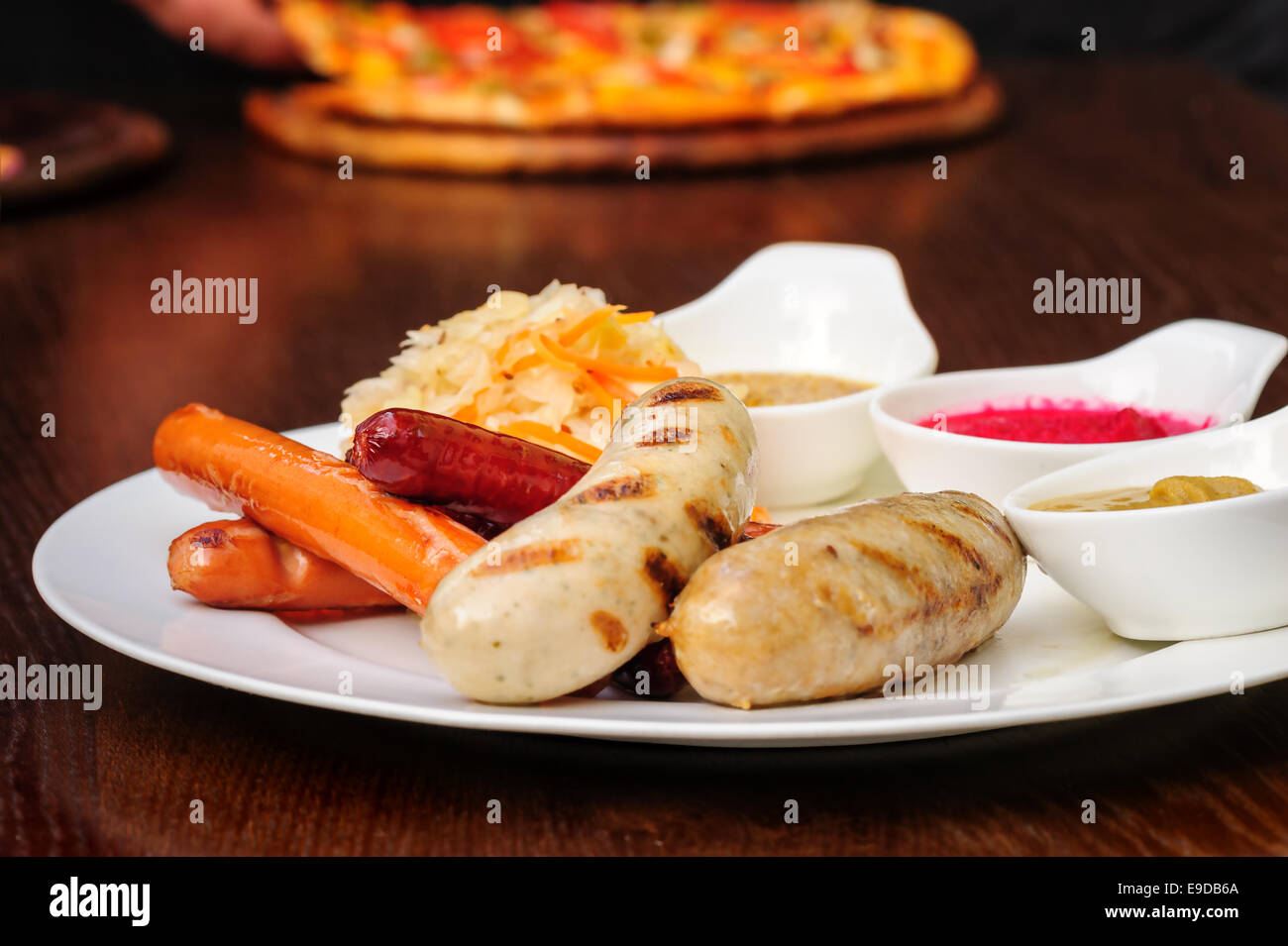 German sausage with cabbage and sauces Stock Photo Alamy