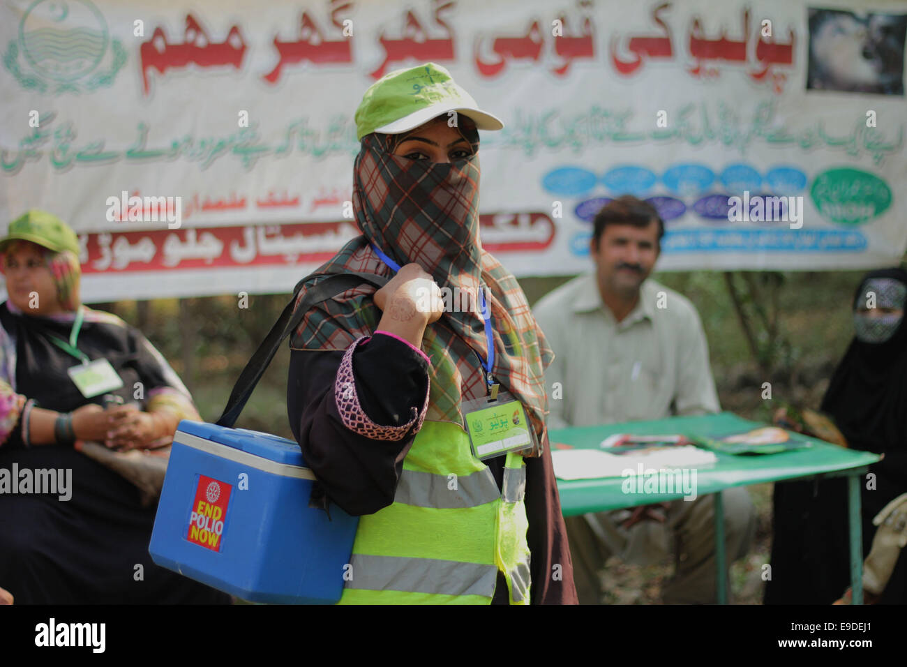 Pakistani Polio Vaccination Team Administering Polio Drops To Children ...