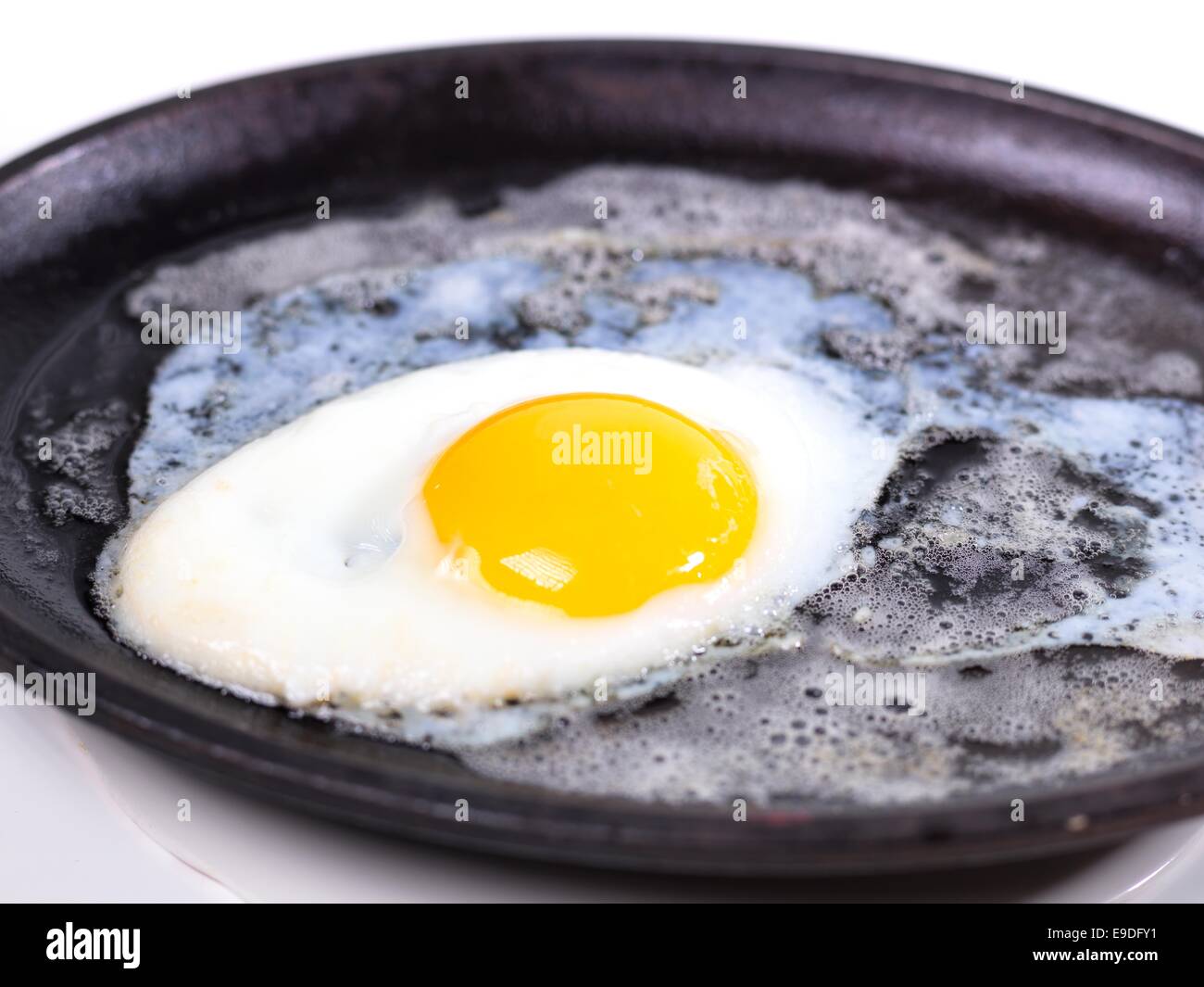 A closeup picture of a fried on the hot frying pan Stock Photo Alamy