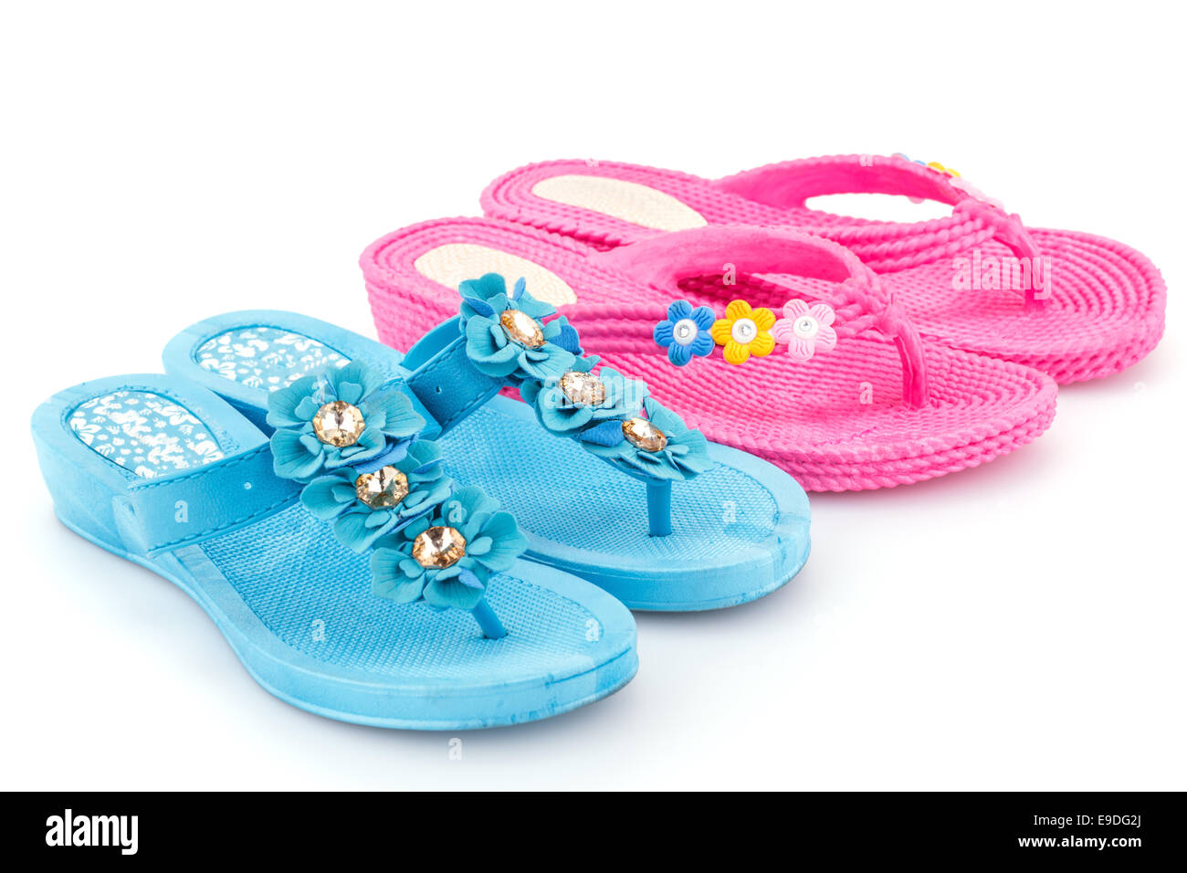 Pink and blue flip flops isolated on white background Stock Photo - Alamy