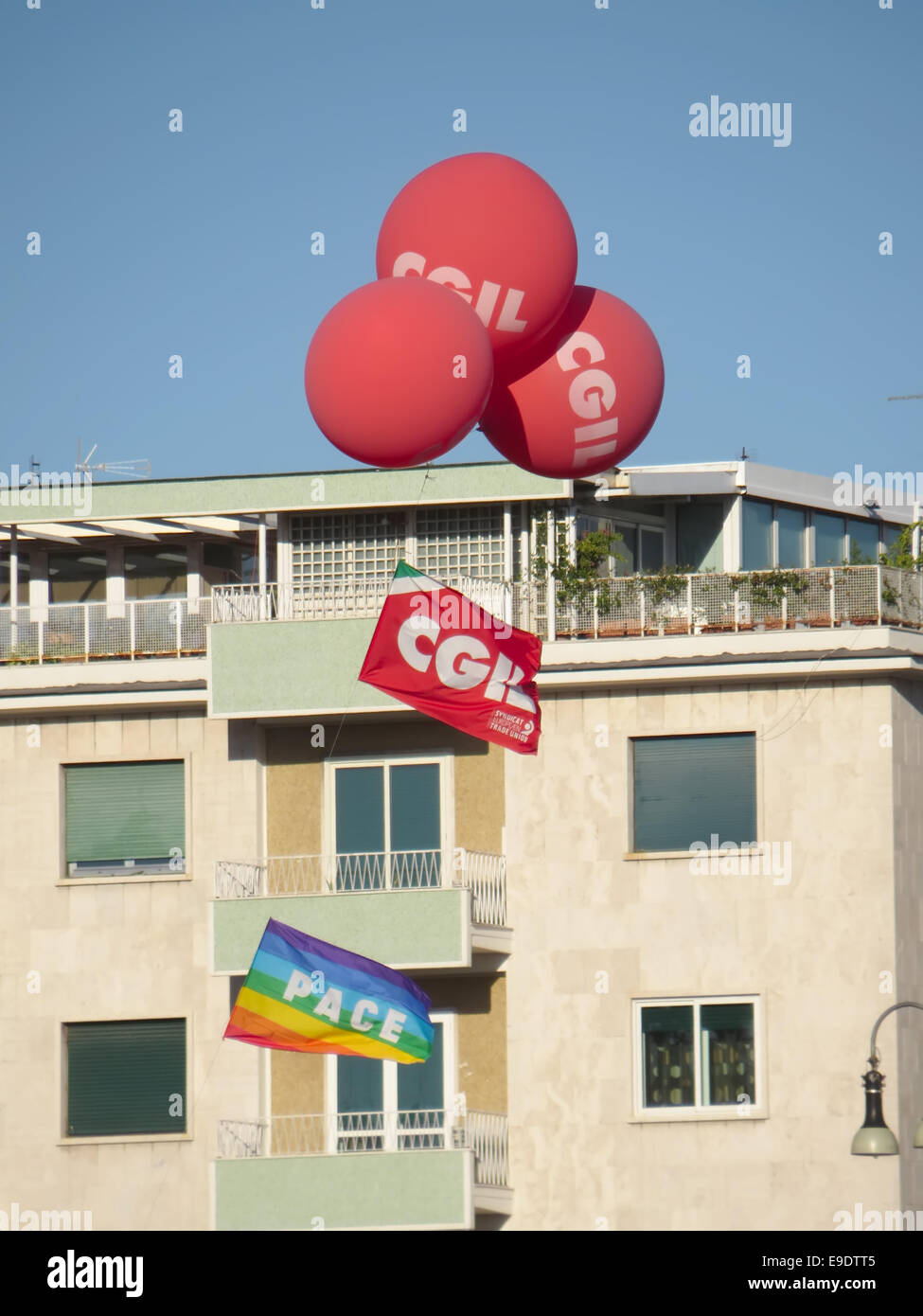 ROME, ITALY - OCTOBER 25, 2014: Flags and balloons of CGIL labor union waving on San Giovanni square Stock Photo