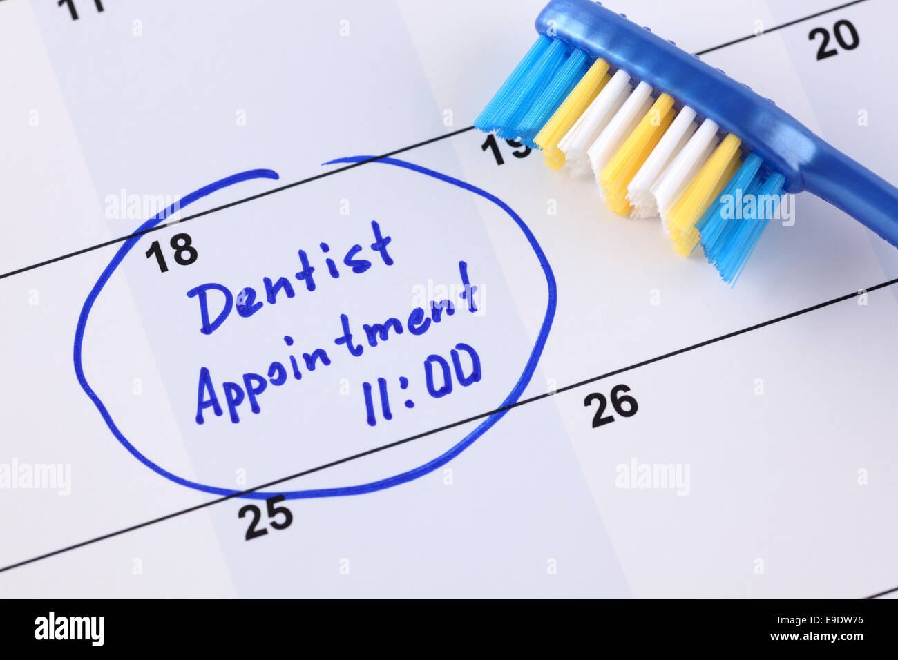 Reminder "Dentist appointment 1100" in calendar with toothbrush Stock