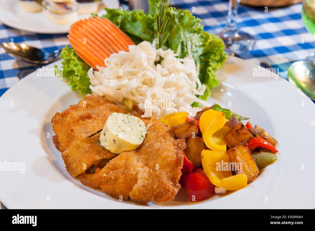 Chicken schnitzel a la carte meal with salad Stock Photo