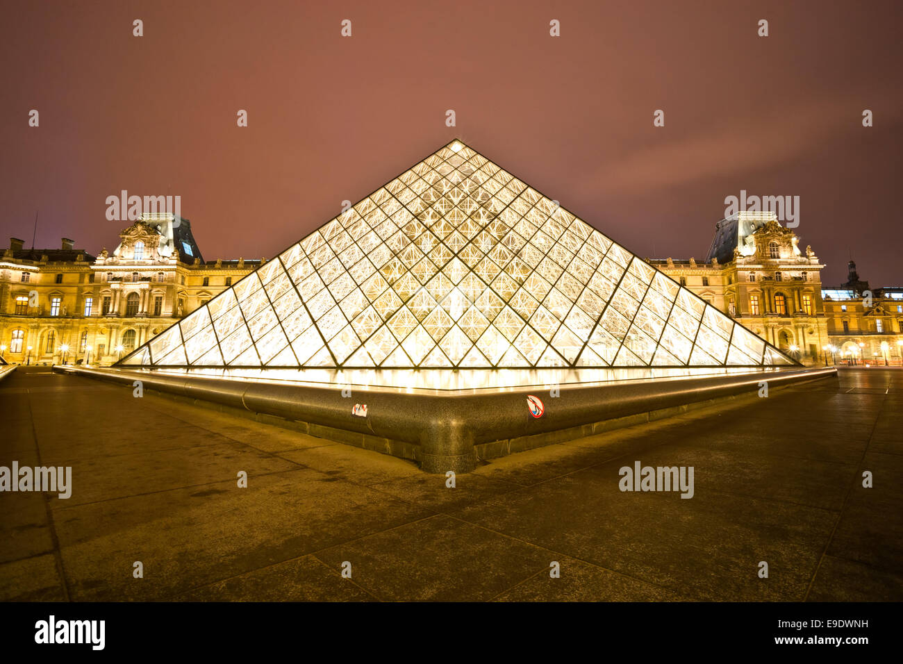 PARIS-DECEMBER 06: The Louvre Art Museum on December 06, 2012 in Paris, France. A central landmark of Paris, over 35000 objects  Stock Photo
