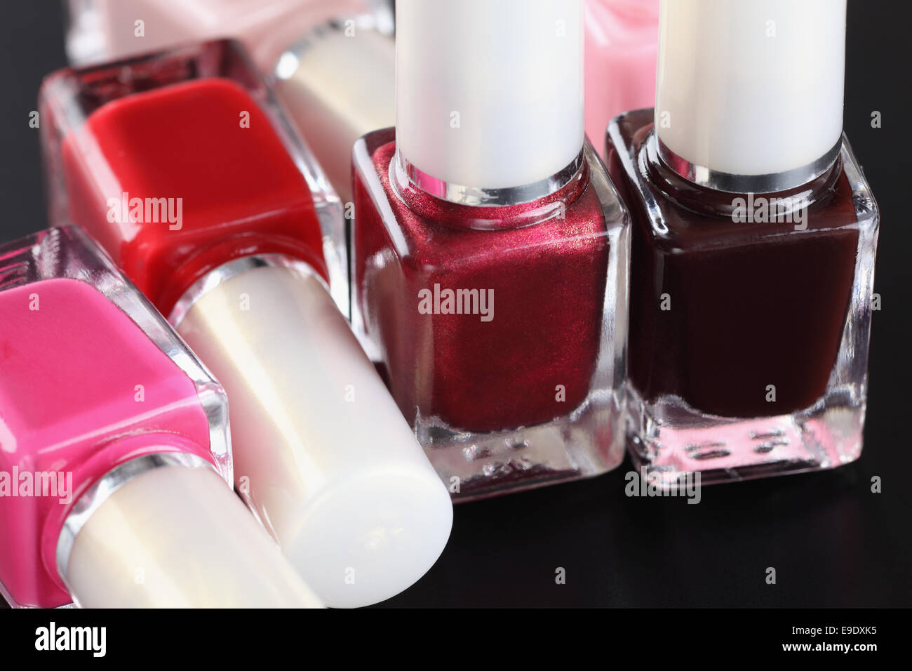 Bottles of nail polish on black background Stock Photo Alamy