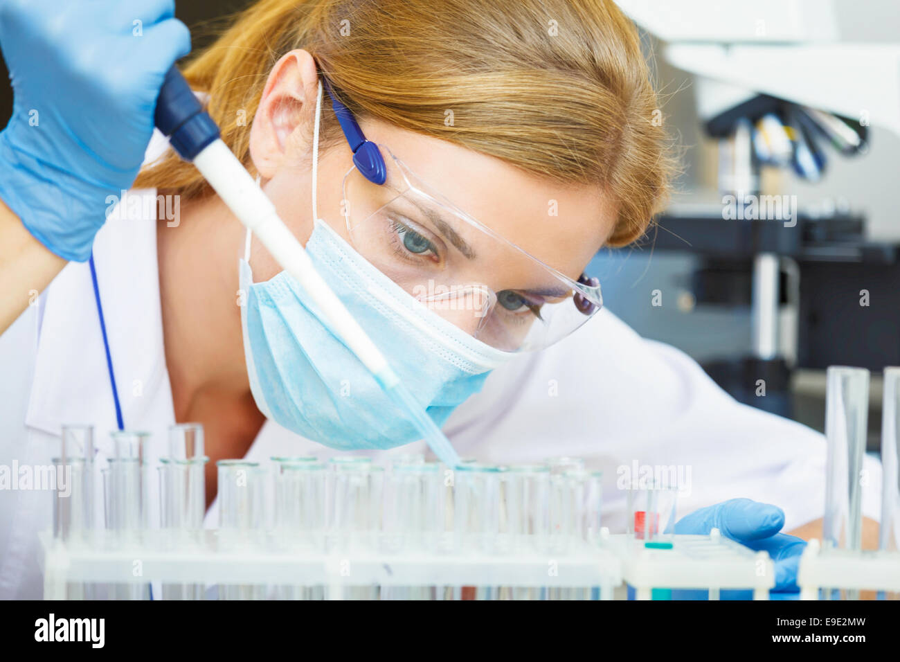 Young beautiful scientist working with samples in lab. Stock Photo