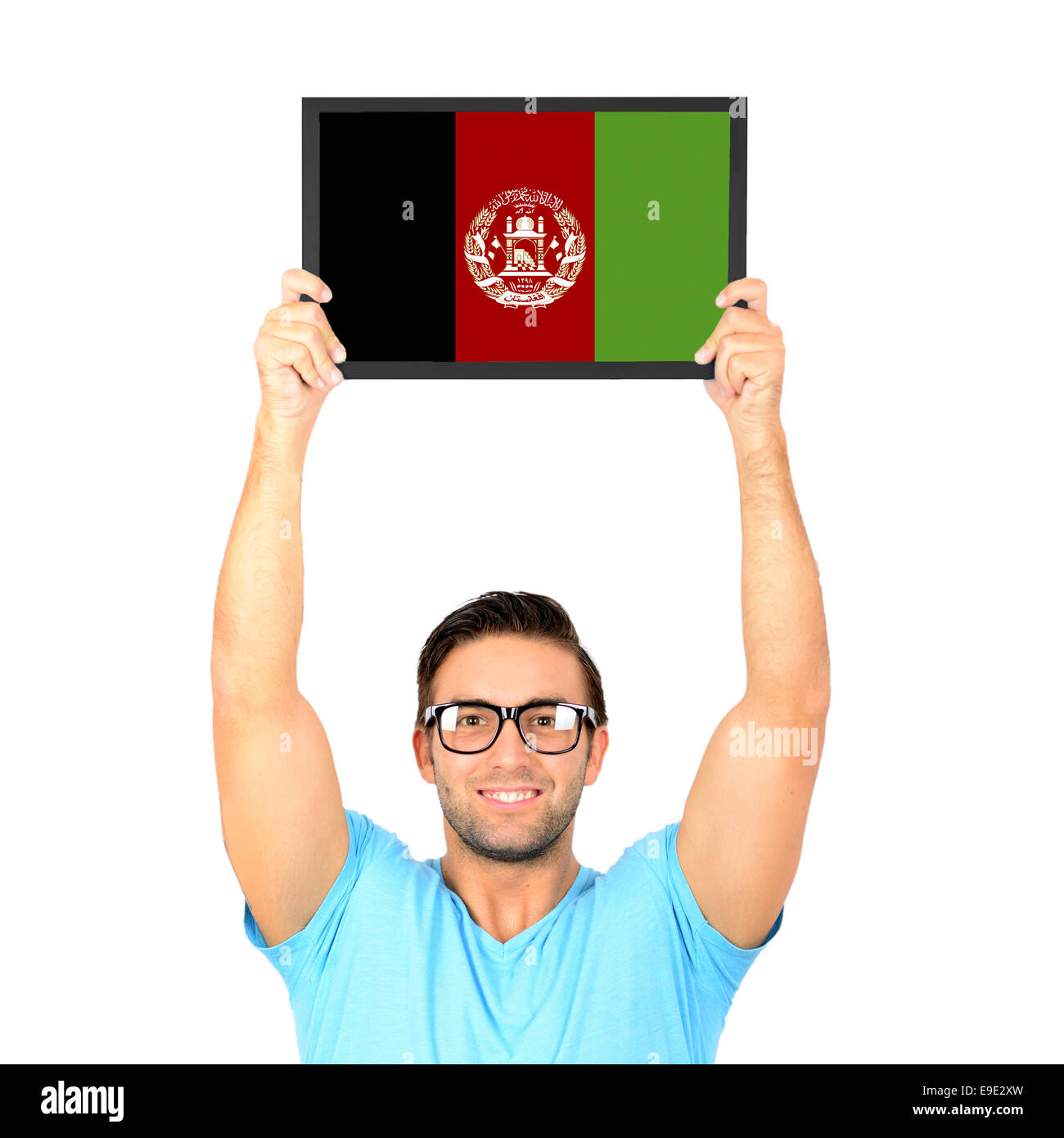 Portrait of a young casual man holding up board with National flag of Afghanistan Stock Photo