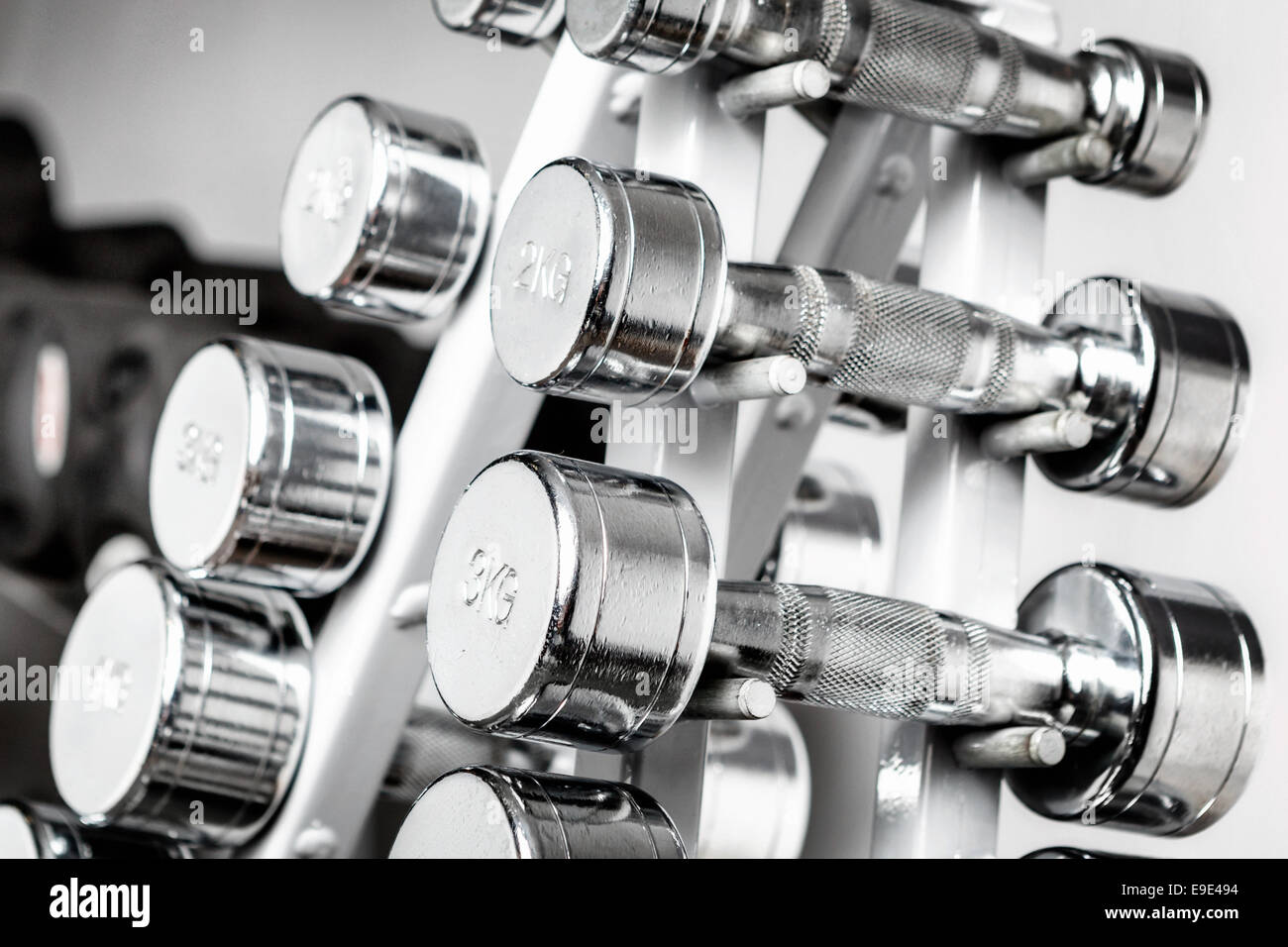 A rack with metal dumbbells Stock Photo Alamy