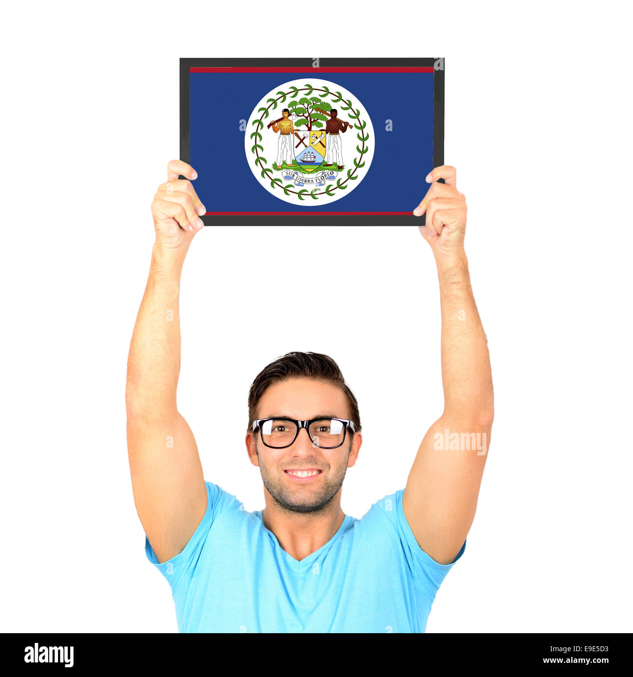 Portrait of a young casual man holding up board with National flag of Belize Stock Photo