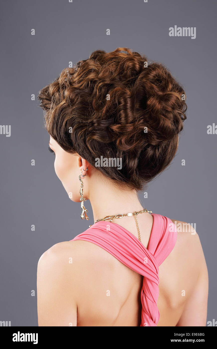 Frizzy Hair. Rear View of Brown Hair Woman with Festive Hairstyle Stock Photo