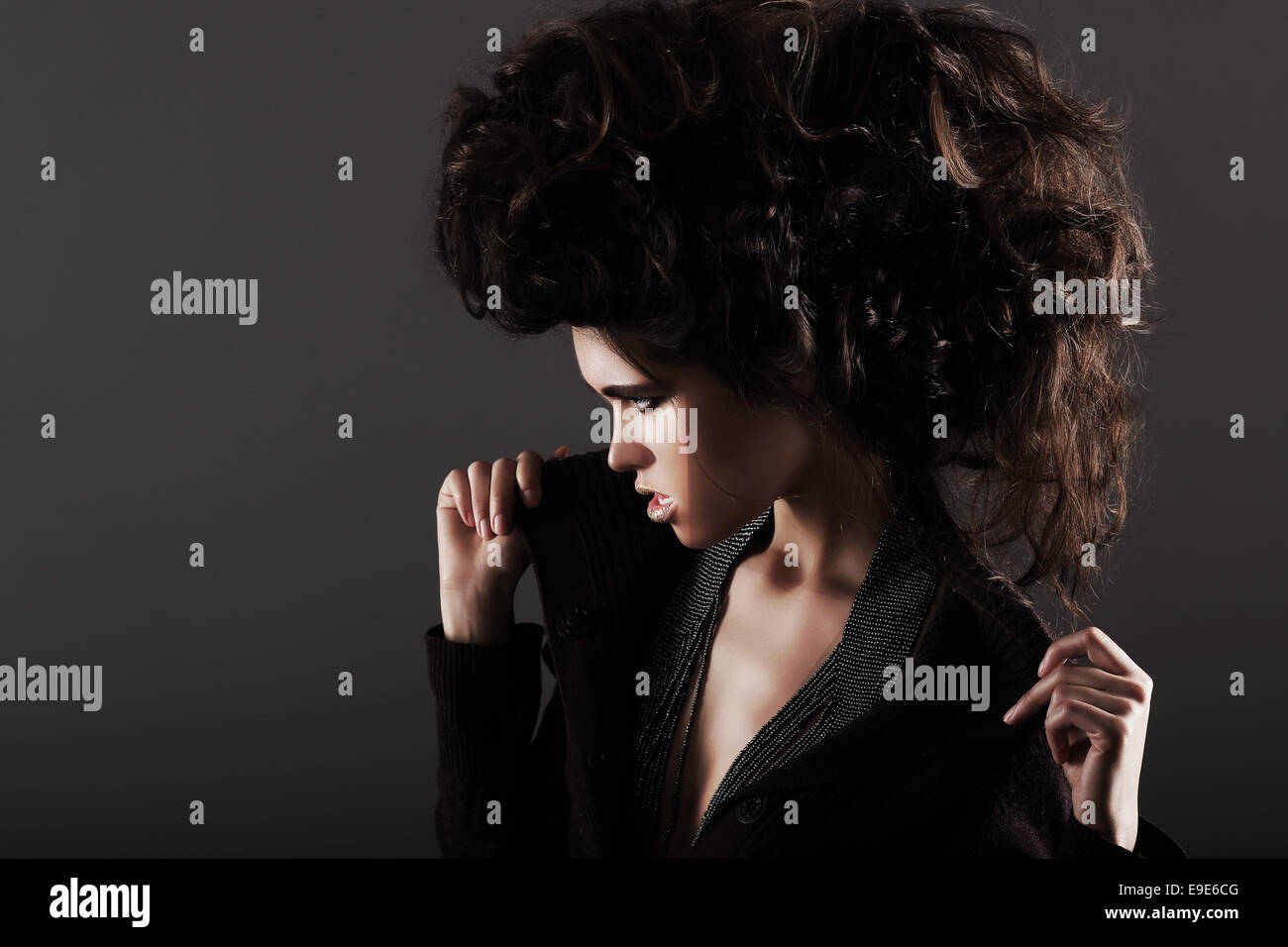 Updo. Eccentric Woman with Styled Curly Hairs Stock Photo