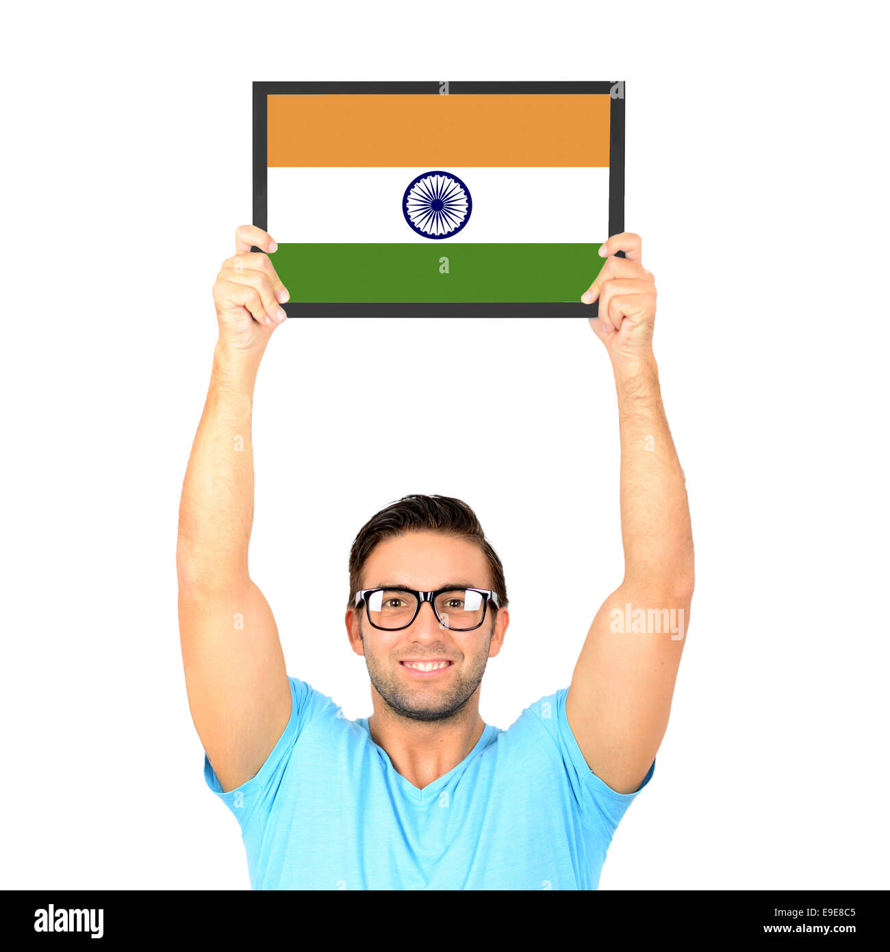 Portrait of a young casual man holding up board with National flag of India Stock Photo