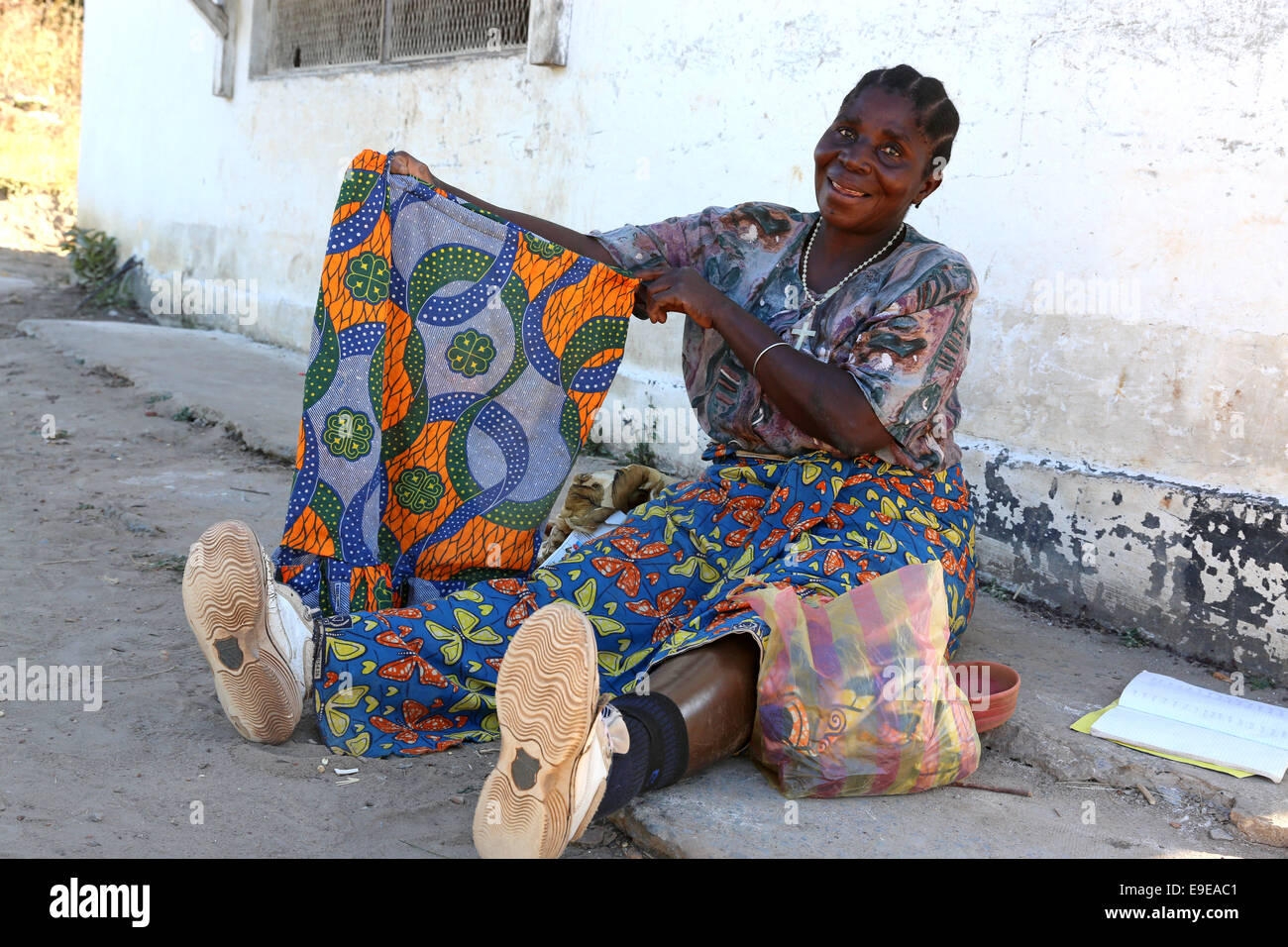 A leprosy sick woman shows her self made skirt in the Chibote Leprosy Rehabilitacion Center in Ibenga, Zambia Stock Photo