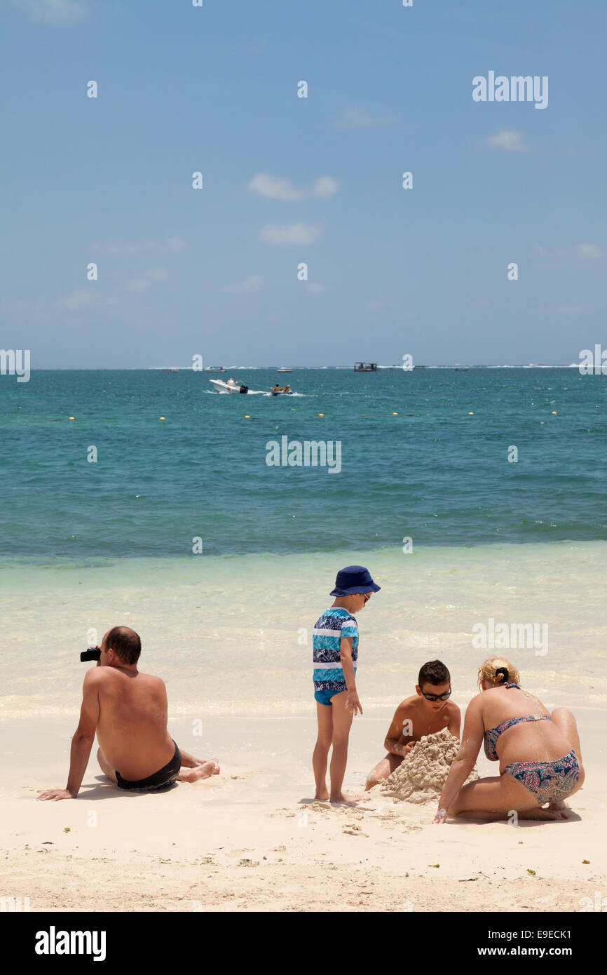 A caucasian family on holiday the beach, Belle Mare, Mauritius Stock Photo