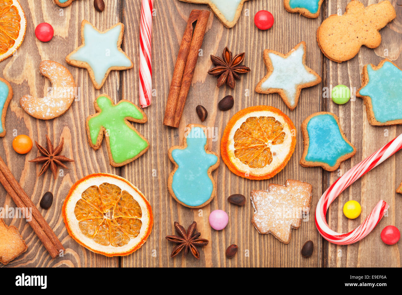 Christmas wooden background with spices and gingerbread cookies Stock Photo