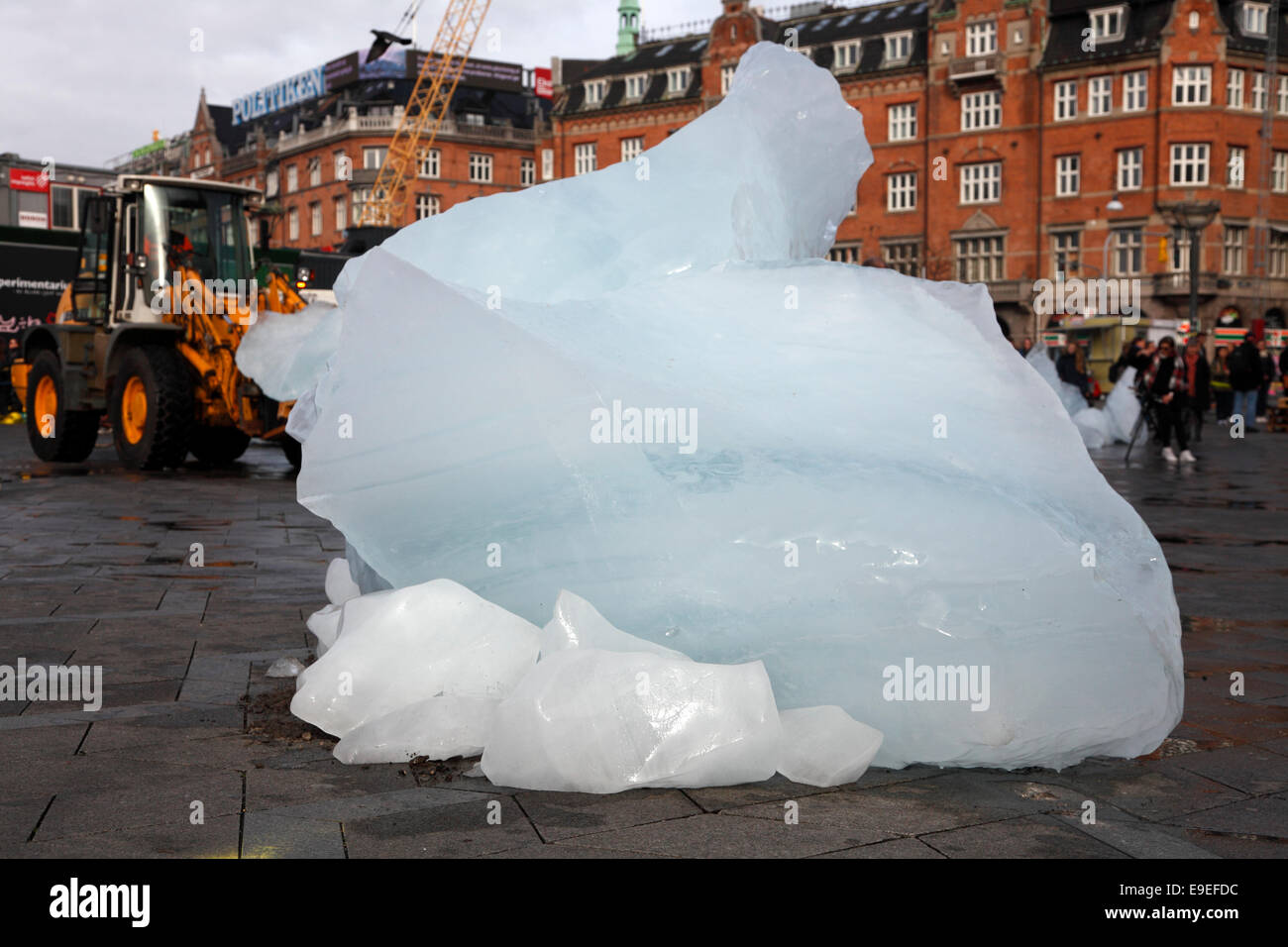 Copenhagen, Denmark. 26 Oct. 2014. The public art piece Ice Watch at the City Hall by Danish-Icelandic artist Olafur Eliasson and geologist Minik Rosing. 100 tons of inland ice transported from Nuup Kangerlua Fiord, Nuuk, Greenland, to Copenhagen in refrigerated containers. The melting of the twelve large ice blocks formed as a clock serves as a climate warming wake-up call: 100 tons of inland ice melt every 100th of a second. The event marks the publication of the Fifth Assessment Report of the UN Intergovernmental Panel on Climate Change meeting 27-31 Oct. in Copenhagen. Stock Photo