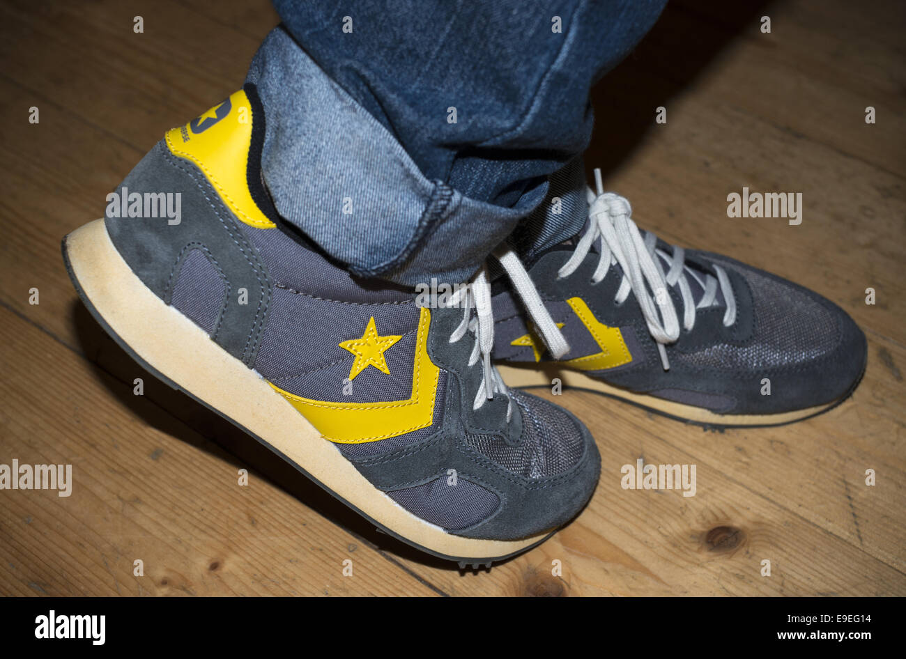 Moonwalking in grey Converse trainers Stock Photo