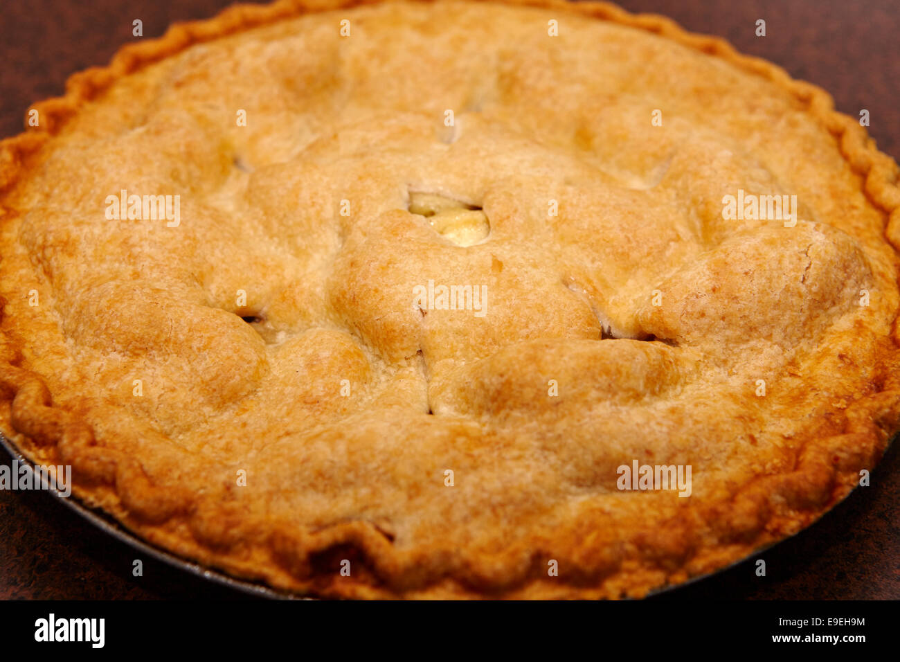 large round mass produced apple pie Stock Photo