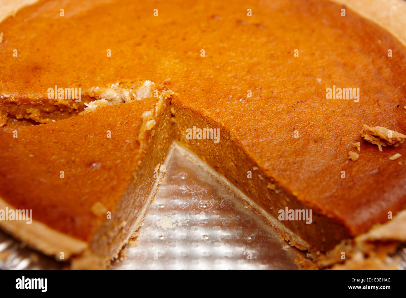 cross section of mass produced pumpkin pie Stock Photo