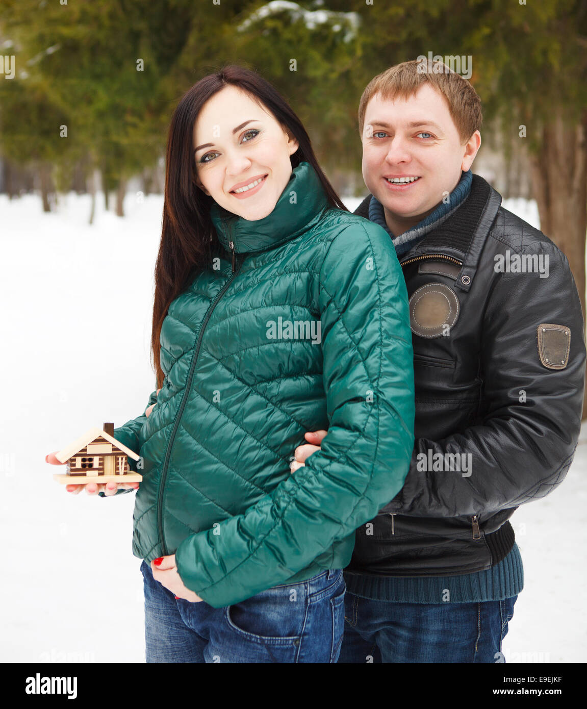 Happy young couple having fun in the winter park Stock Photo - Alamy