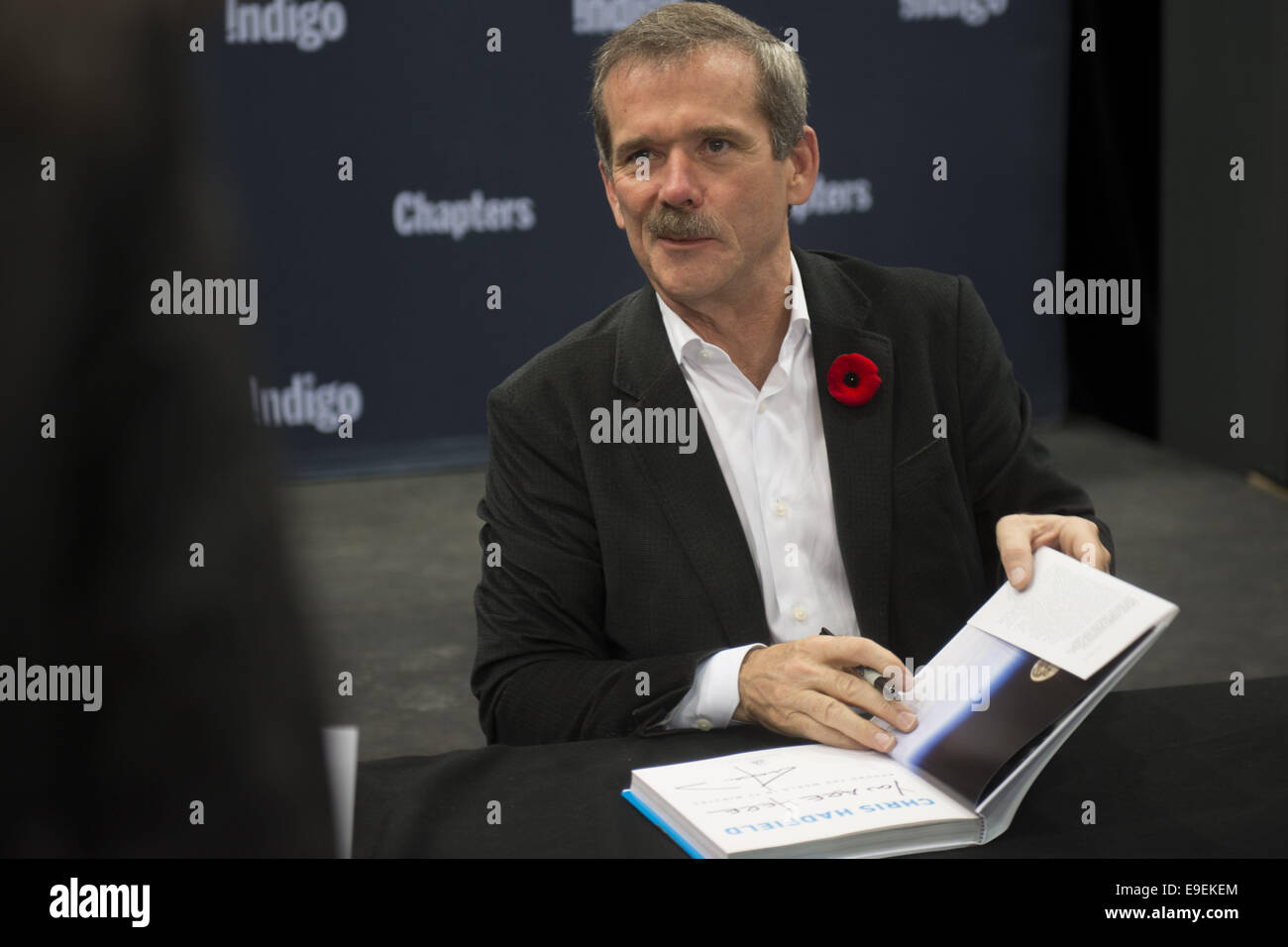 Calgary, Canada. 26th Oct, 2014. Canadian astronaut CHRIS HADFIELD launches new book full of space photography titled ''You Are Here'' and hosts a signing at one of Calgary's Indigo bookstore locations. Credit:  Baden Roth/ZUMA Wire/Alamy Live News Stock Photo