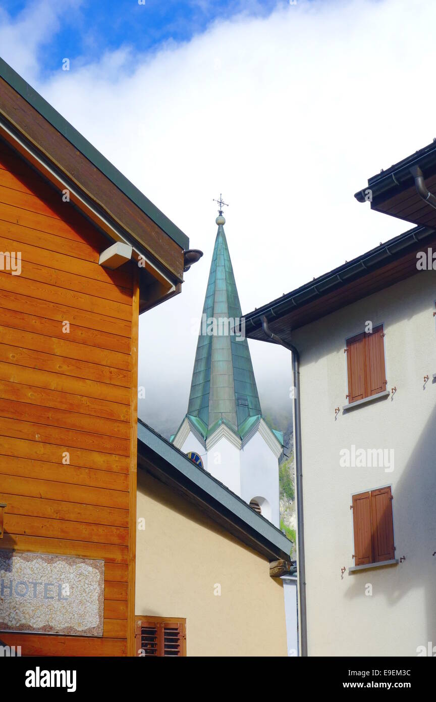 Residential buildings and church tower in Leukerbad, Switzerland Stock Photo