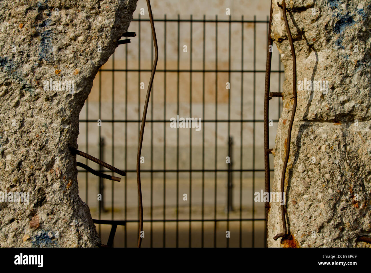 View through Berlin wall wire fence urban gap Stock Photo