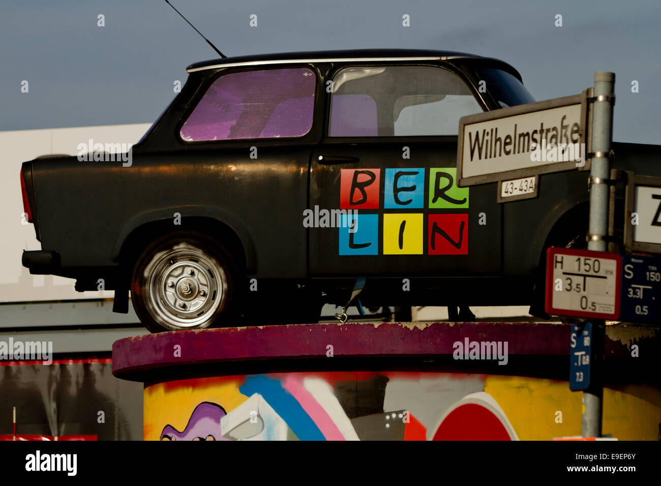Trabant car on top of kiosk Berlin Branding sign Stock Photo