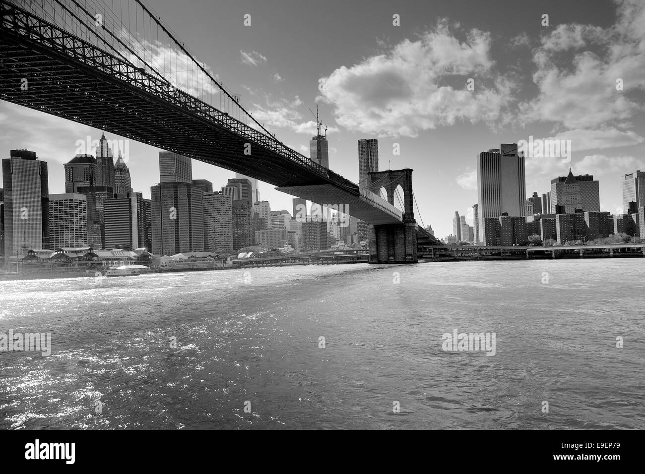 A view of the lower Manhattan and Brooklyn bridge black and white Stock