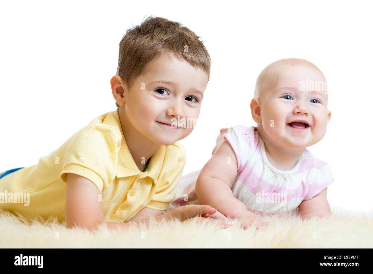 Cute kids brother and sister lying on floor Stock Photo