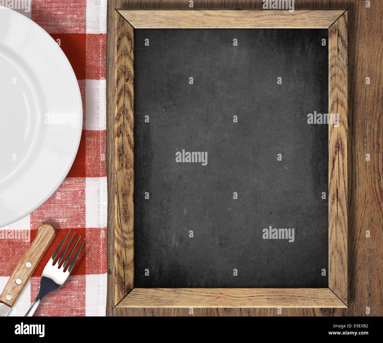 Menu blackboard top view on table with plate, knife and fork Stock Photo