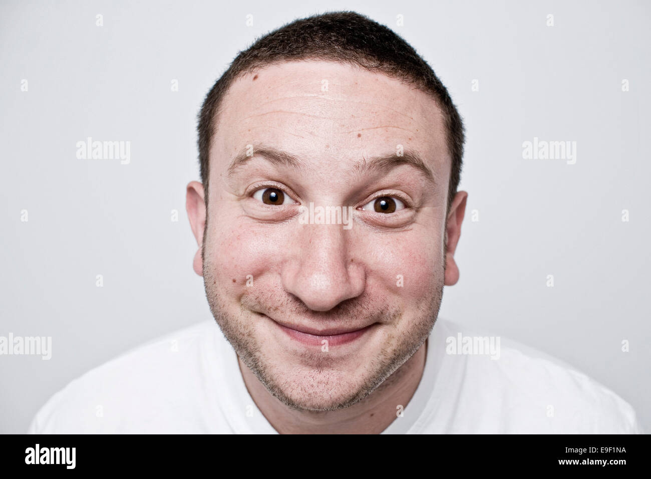 a man with a funny face smiles at the camera Stock Photo - Alamy