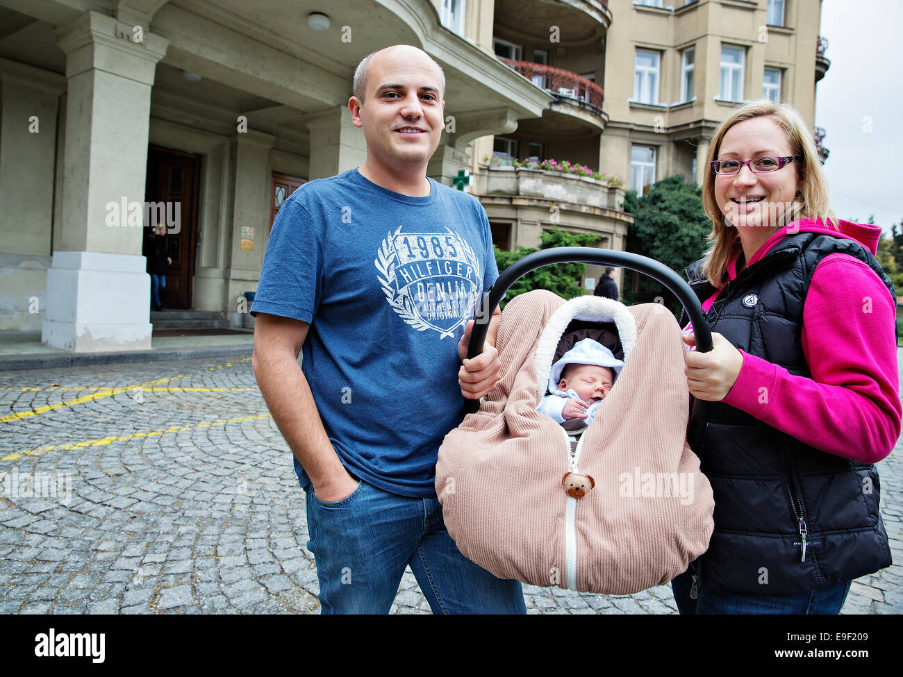 The parents with their three days old newborn baby leave the Maternal