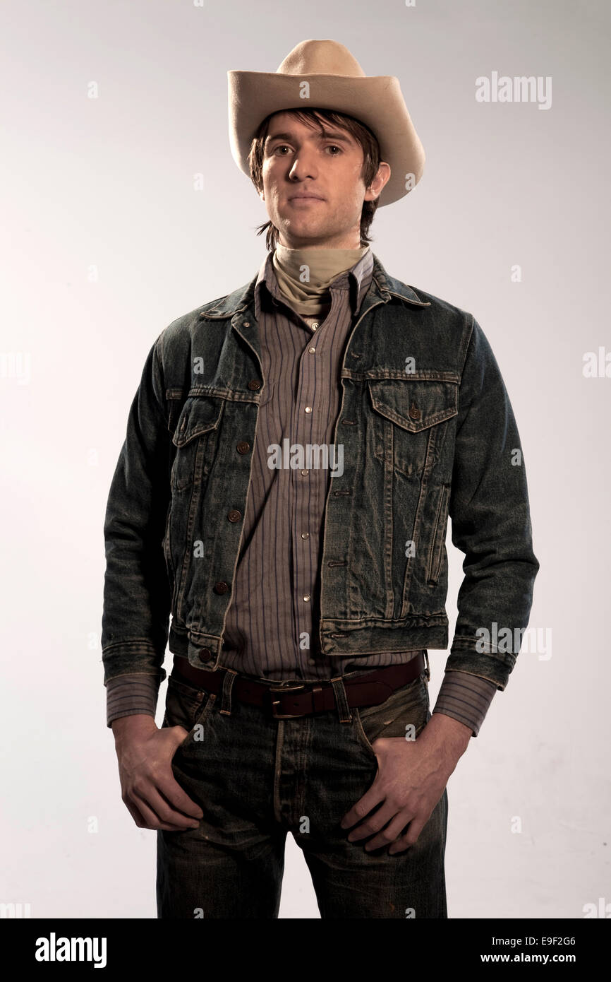 Man In Cowboy Hat Denim Jacket Looking Like A Farmhand Cowboy Stock Photo Alamy