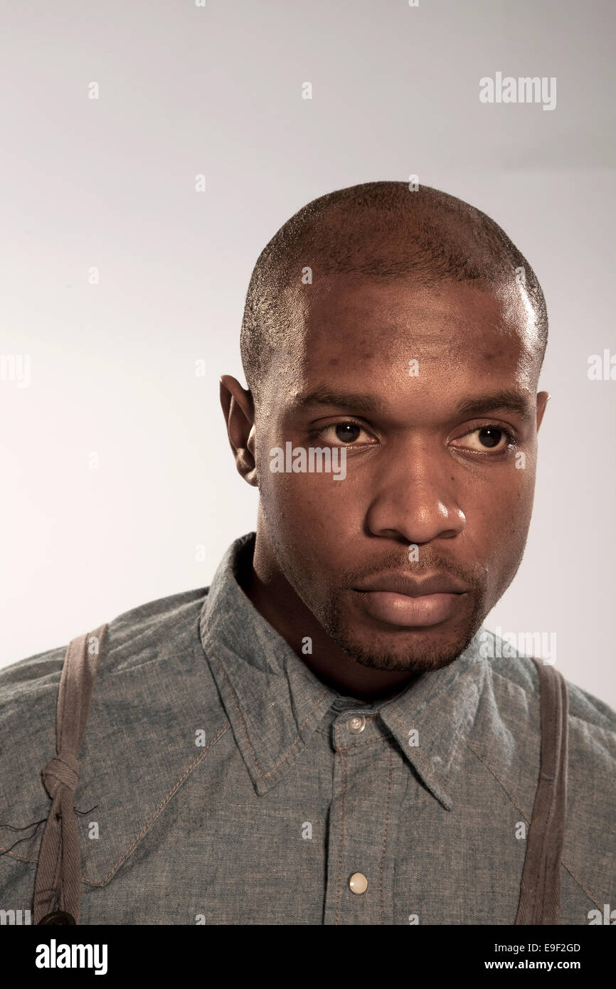 Head Shot Portrait Of A Good Looking Black Man In Denim Shirt