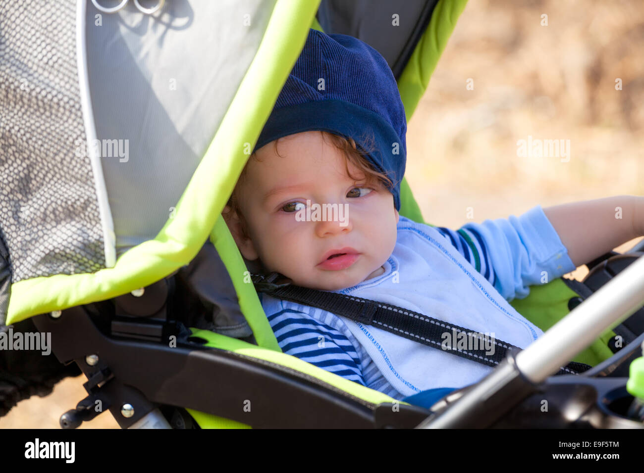 Baby boy out for fresh air in stroller. Stock Photo