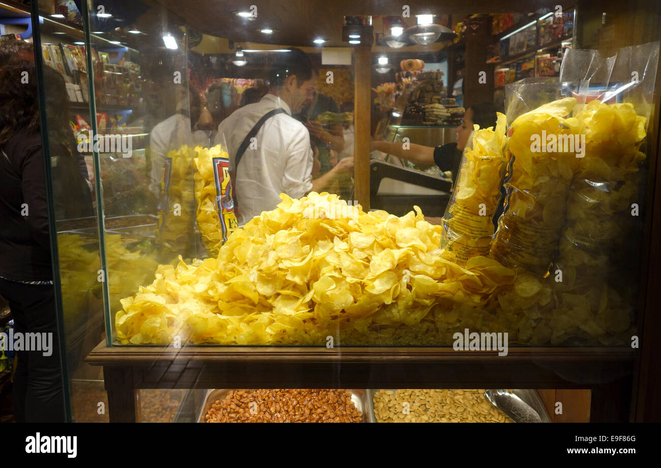 Homemade Crisps or potato chips bags on display in store, shop in