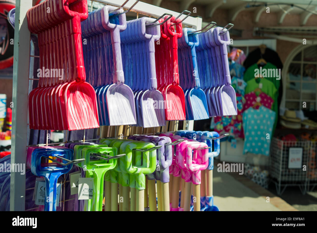 Plastic spades for sale on Herm Island resort UK Stock Photo - Alamy