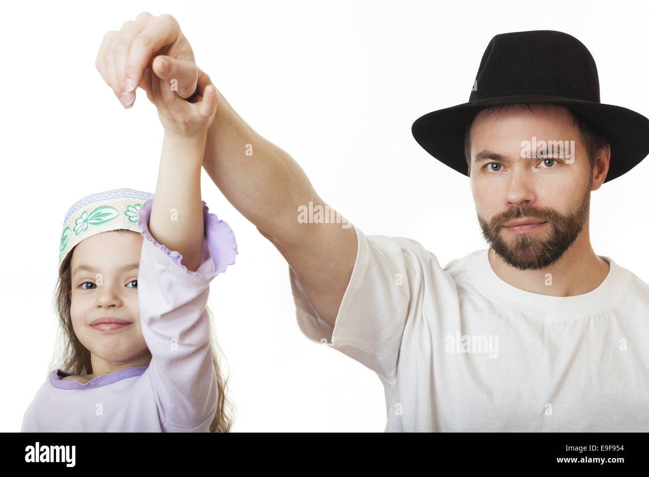 Man in Jewish hat and girl in skullcap. Stock Photo
