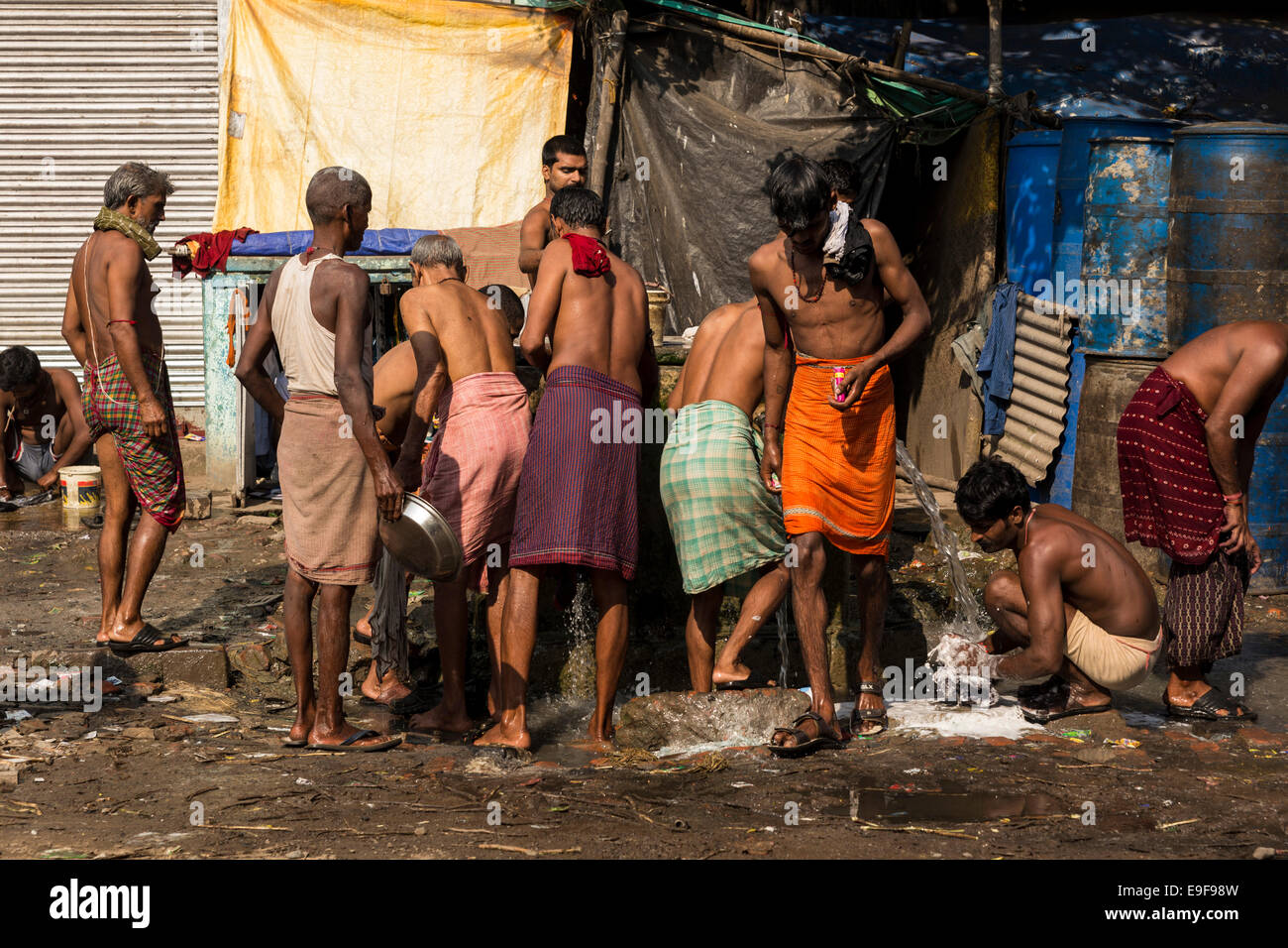 Men taking care of their personal hygiene. Kolkata, West Bengal, India