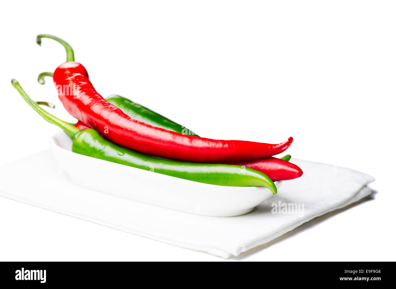 Green and red chili peppers isolated Stock Photo Alamy